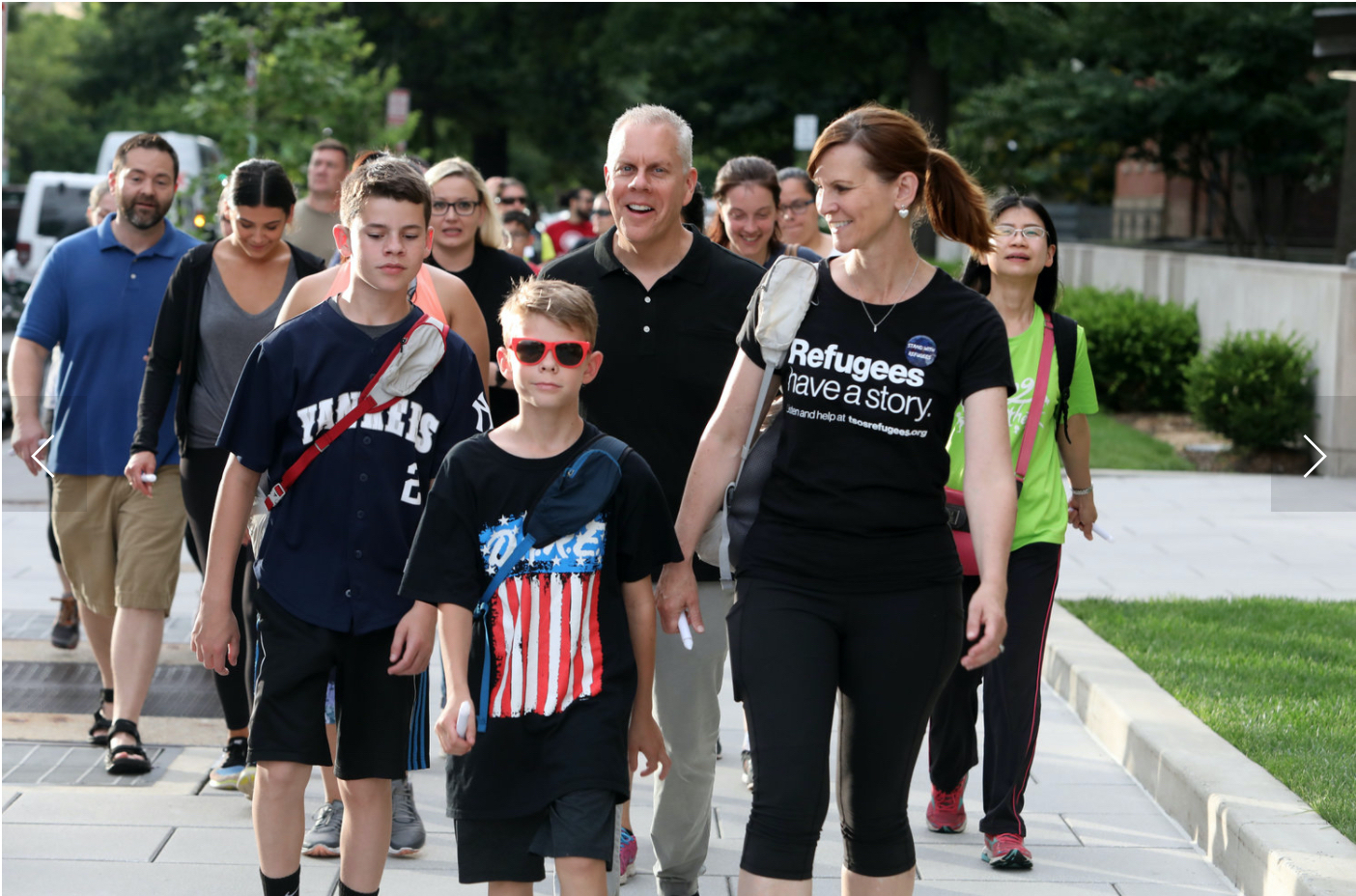 A group of walkers including young children and adults are among the walkers.