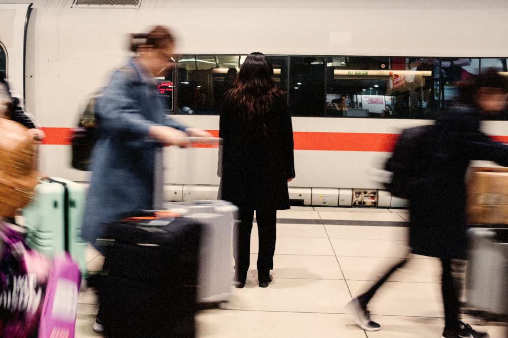 A refugee woman arrives at a train station
