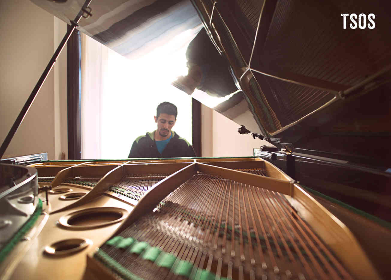 Aeham Playing Piano